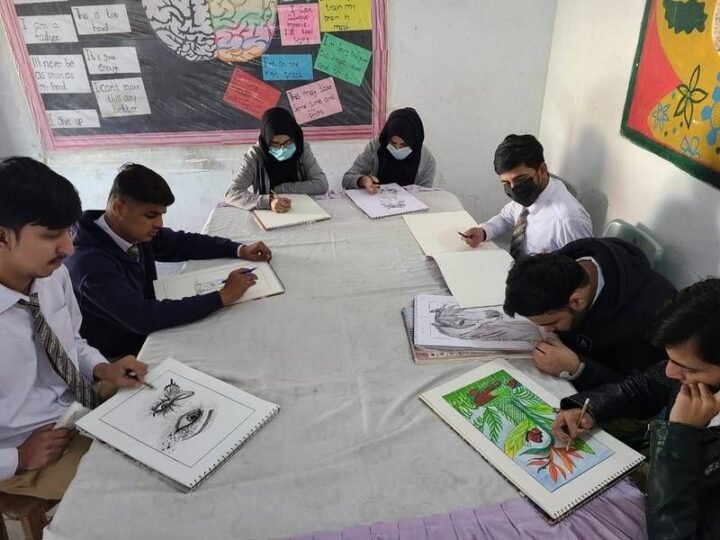Students sharing a table during drawing practice