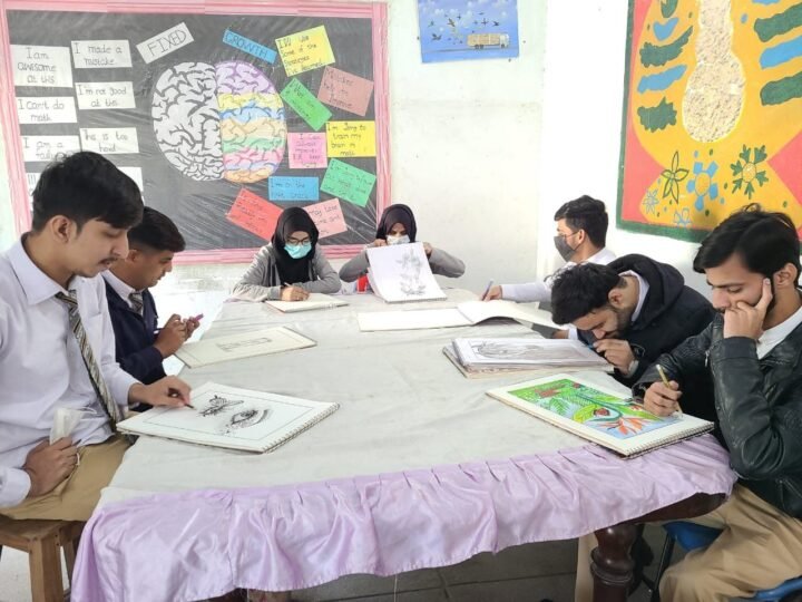 Students drawing and painting together during an art class at NID