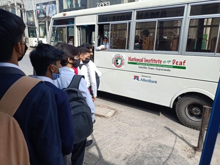 Students boarding the NID school bus — free transport facility